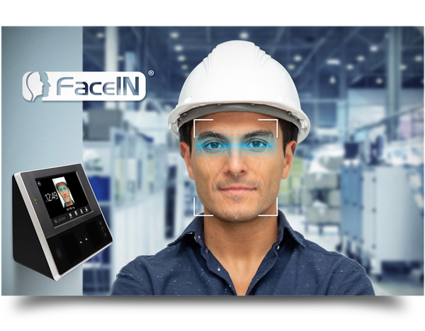 A factory worker that is using a face scanning time clock